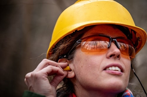 Woman with earplugs istock casaraguru