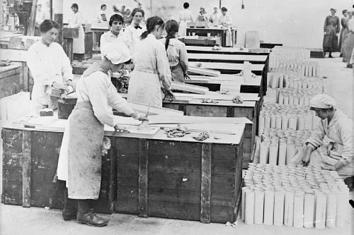 Female workers painting and rolling asbestos cylinders for use as smoke shells in a Lancashire factory during the First World War. Photograph: Lewis G P