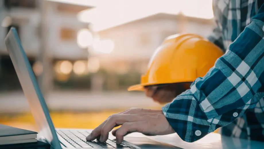 Health and safety professionals reviewing information in an industrial workplace