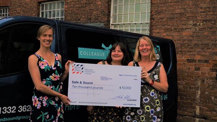 Jo Saines, Wellbeing Services Manager at British Safety Council presents a Keep Thriving Funding Award to Safe and Sound’s Business Support Officer, Alex Day (middle) and CEO, Tracy Harrison (right).