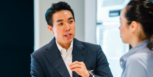 Man and woman having a discussion in an office