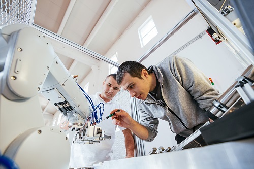 Technician Working On Robotic Arm Photo Istock 856905066 Drazen Lrge