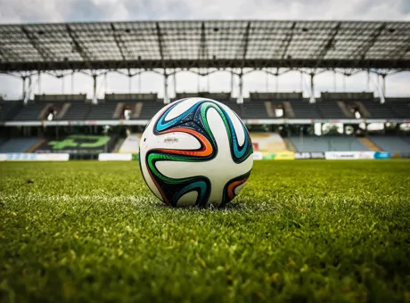 Football on a stadium pitch, representing heat stress risks and worker safety lessons from the 2026 FIFA World Cup